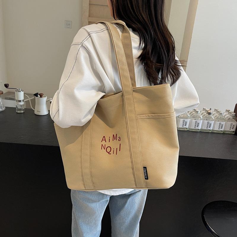 Lässige Canvas-Tragetasche Damen Herbst und Winter Schlichte Große Kapazität Ausgehen Leichte Tragetasche Pendlertasche