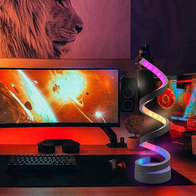 Moderne bunte Schreibtischlampe in Spiralform mit dreifarbiger Dimmfunktion über USB, geeignet für verschiedene Raumtypen.