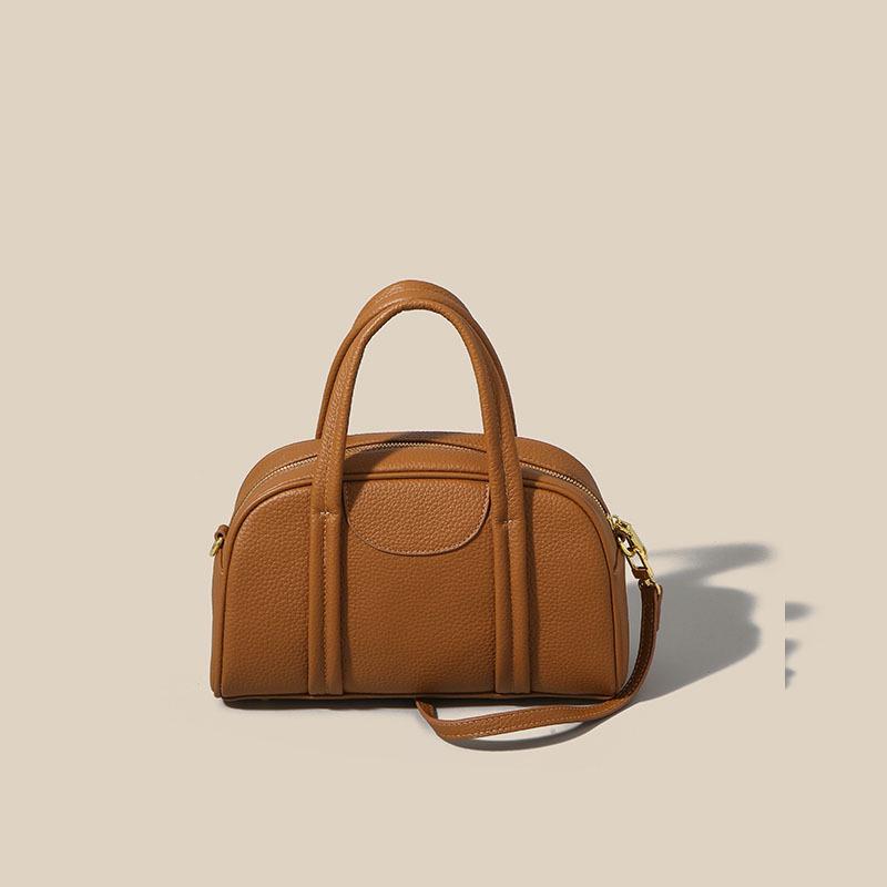 

Cross-Border Genuine Leather Women s Boston Handbag: 2025 Autumn Style, Top Layer Cowhide, Fashionable Large Capacity Shoulder & Crossbody Bag.