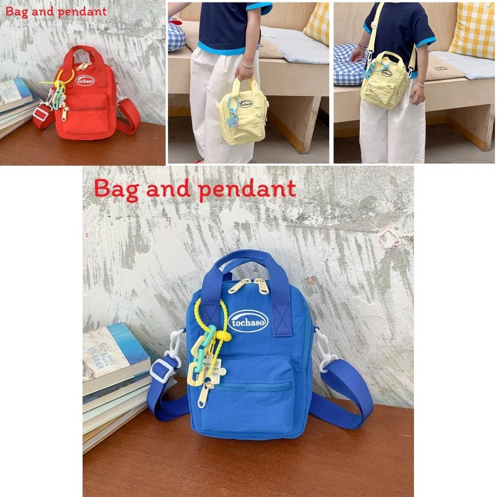 Simple Solid Color Letter Printed Children Single Shoulder Bag With Pendant For Kids School Day Use
