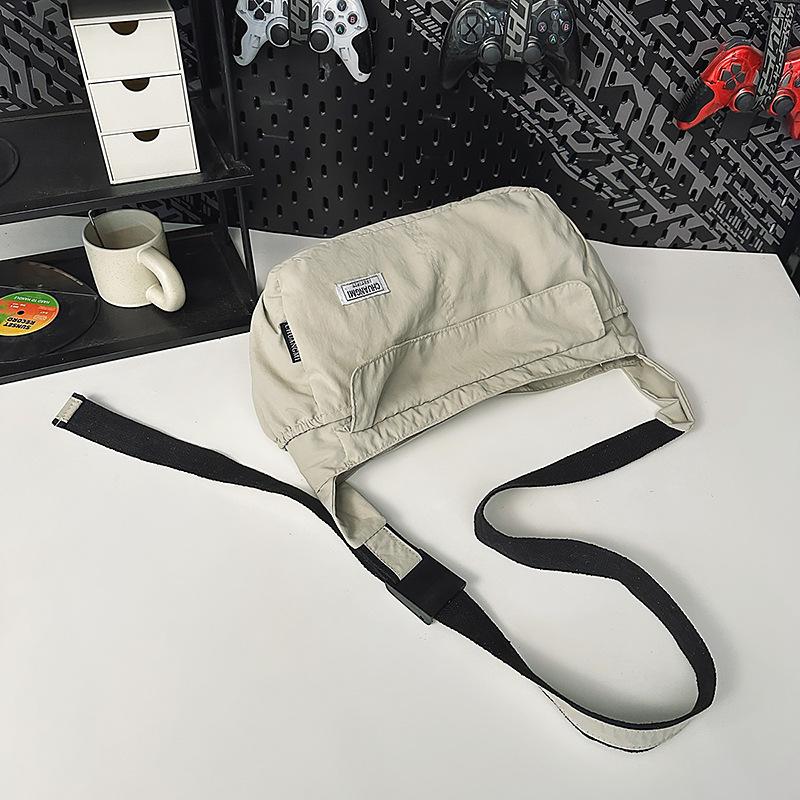 

Japanese messenger bag women s sports commuter shoulder bag light tooling style mail carrier bag men s trend college student class bag