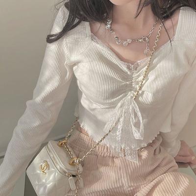 T-shirt à manches longues en dentelle japonaise pour femmes en début d'automne, adapté pour être porté aussi bien à l'intérieur qu'à l'extérieur, avec un design de haut pour fille de niche et épicé.