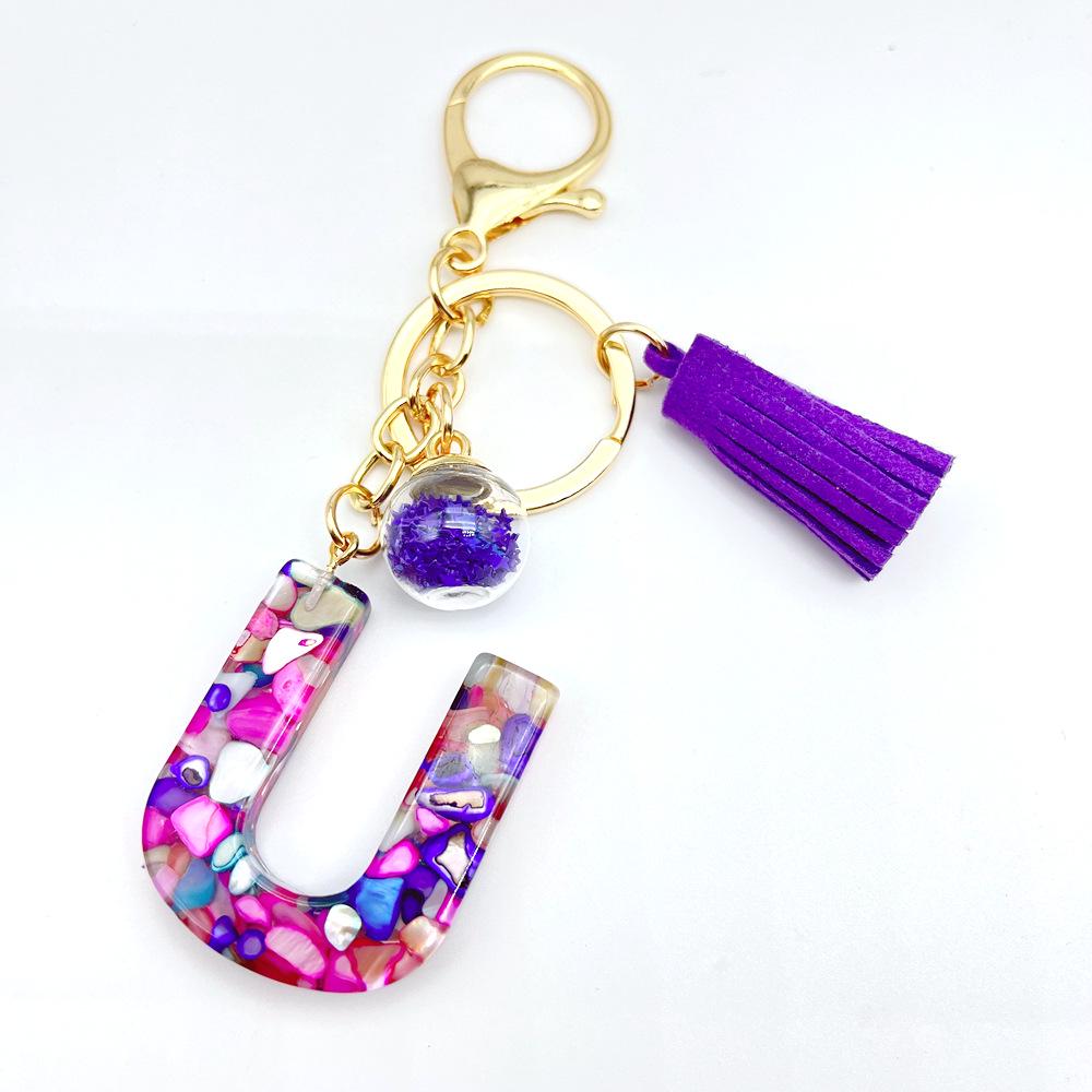 Europäischer und Amerikanischer Bestseller Englischer Initialschlüsselanhänger mit Lila Quasten-Accessoire