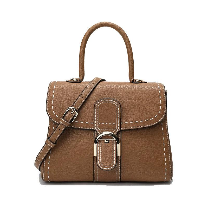 Factory supply, simple horseshoe buckle handbag, fashionable and versatile single shoulder oblique span lock bag, first layer cowhide women s bag 20cm