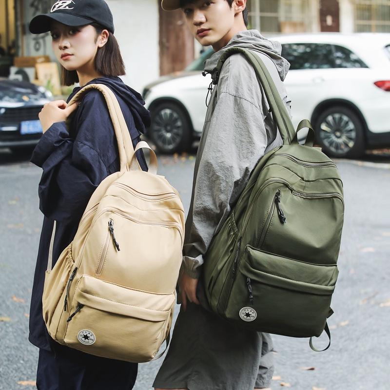 Niche Lightweight Nylon Backpack: Large-Capacity, Casual, Unisex Shoulder Bag for Commuters and Students