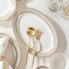 European Style Gold Rim Ceramic Dinnerware Set - Includes Large Bowls, Soup Bowls, Plates, and Rice Bowls for New Year Celebrations.