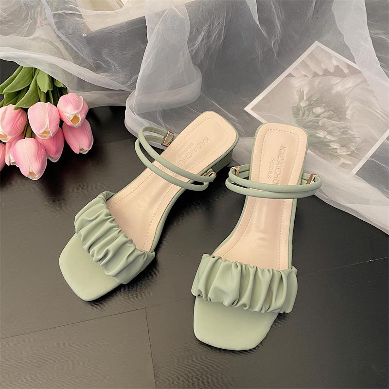 

Two women wearing sandals 2025 new summer lady medium thick heel with fairy wind wearing high-heeled cool slippers 40 зелений