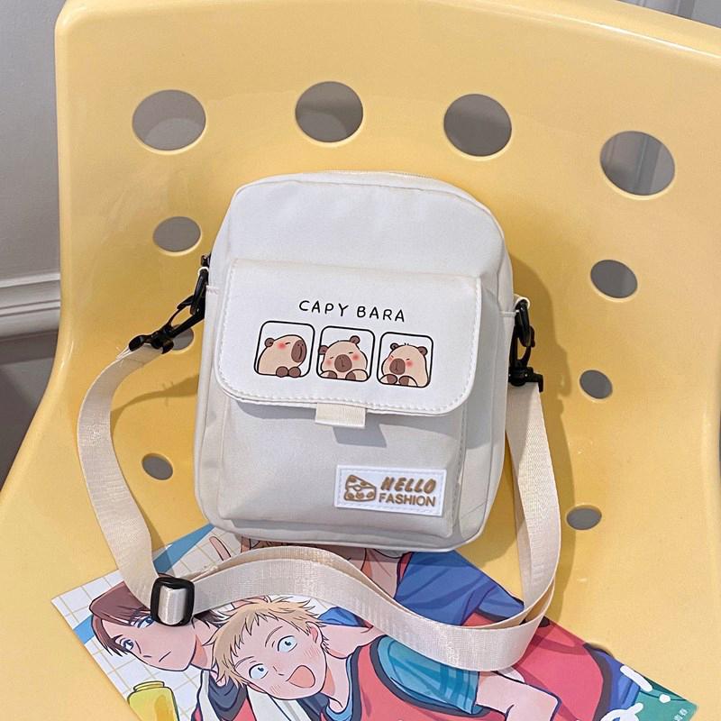 

2025 Мультяшная сумка-кроссбоди Капибара Прочная Портативная Сумка Капибара из Нейлона Сумка через плечо Капибара Унисекс белый