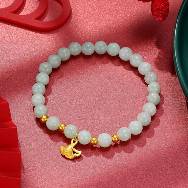

Lucky Fortune Lily & Ginkgo Bracelet: Sand Gold Elastic with Fu Charm for Women