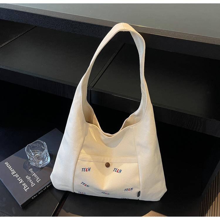 Canvas bag Women's shoulder bag Large capacity commuter tote bag Versatile student armpit bag