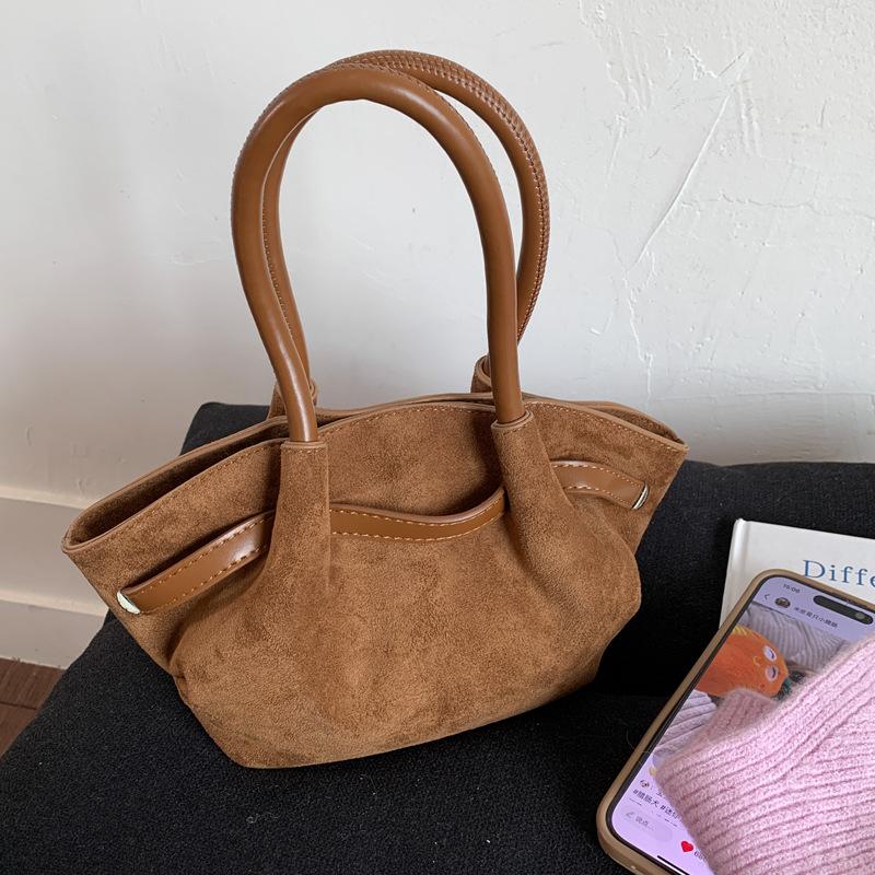 Frosted retro portable small bag women's 2025 new fashion bucket bag niche design messenger bag wing bag tide