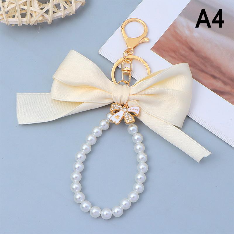 

Креативный брелок для ключей с большим бантом, жемчужная цепочка, женский кулон для сумки, брелок для ключей от машины, подвеска для сумки-тоут