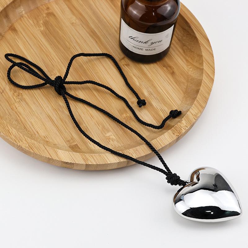 The same black rope big love pendant necklace plated with real gold exaggerated personality peach heart sweater chain spring and summer