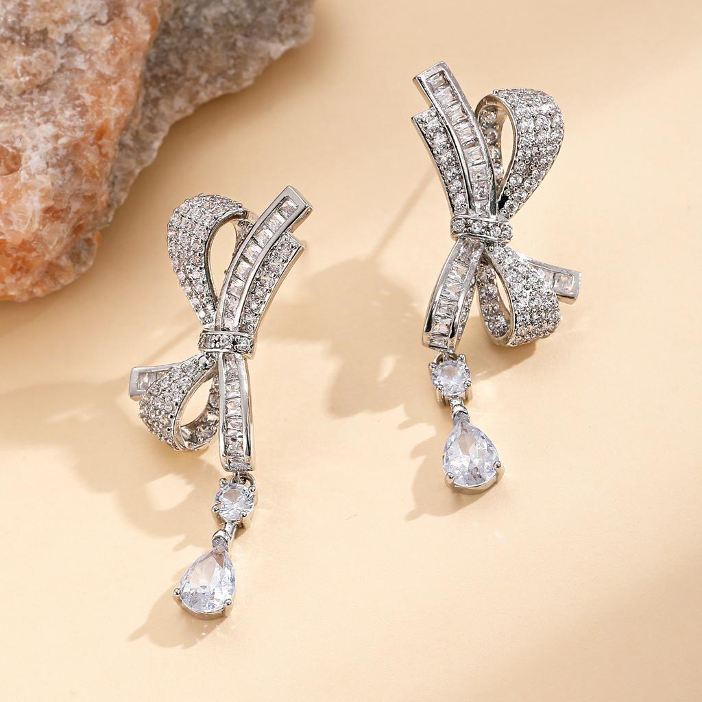 2025 Leichter Luxus High-End Voll-Diamant Schleife Wassertropfen Ohrringe ins Temperament vielseitig Internet-Berühmtheit personalisierte Ohrringe Ohrringe