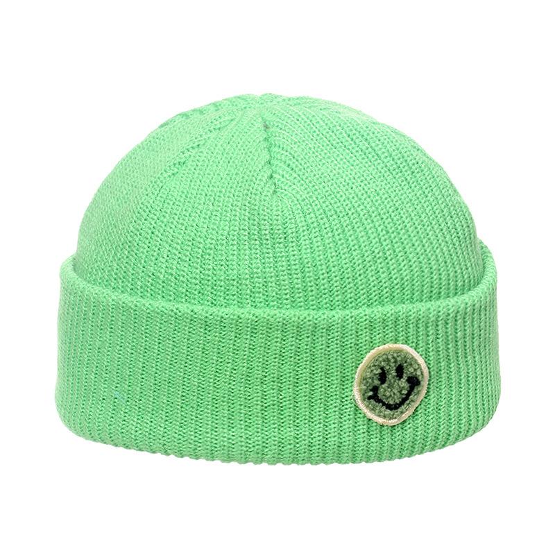 Autumn and winter wool hat male trend Japanese and Korean yuppie knitted warm smiley face sticker landlord hat candy color melon fur hat female