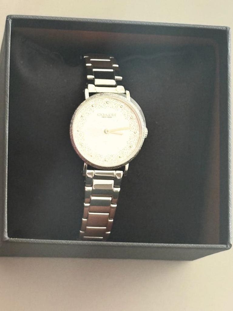 COACH watch silver stone embellishments.