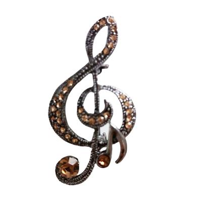 [R8526] - Broche de design 'Music' em âmbar prateado (clave de sol) - 45x23mm