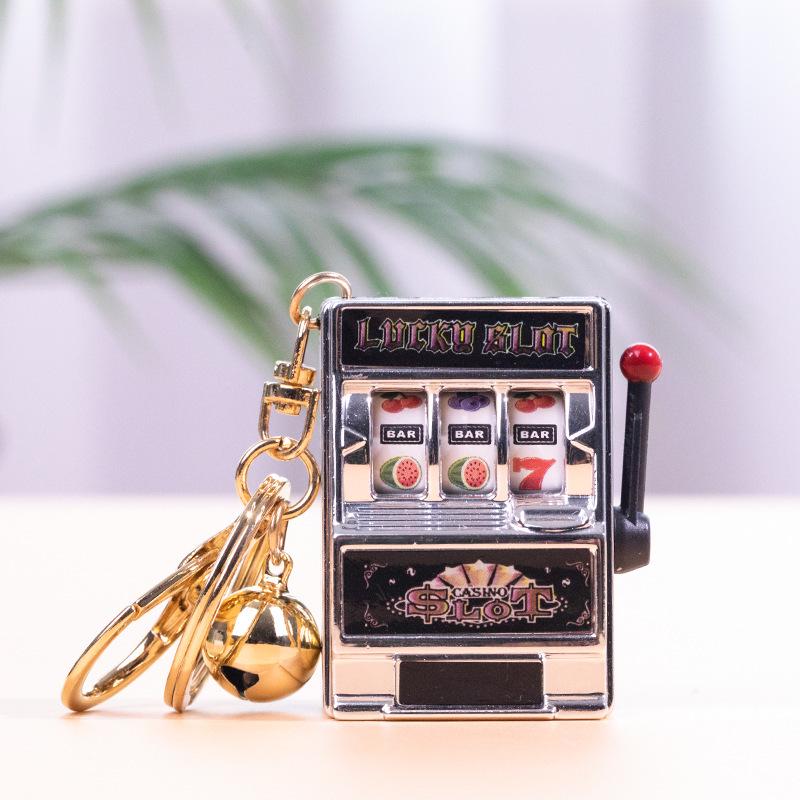 Gold-Plated Creative Tiger Fruit Machine Keychain Toy with Lottery Play Feature