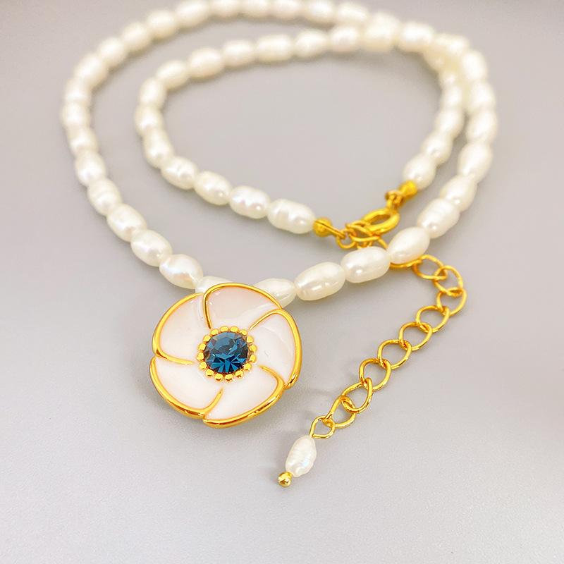 

Meier Enamel sunflower pendant necklace with cultured pearl chain - a stylish and elegant statement piece