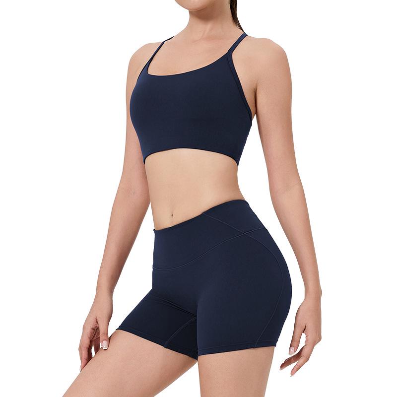 Women's High-Waist Fitness Set: Sports Bra with Pads, Beautiful Back Design, and Three-Point Peach Lift Shorts for Yoga and Pilates.