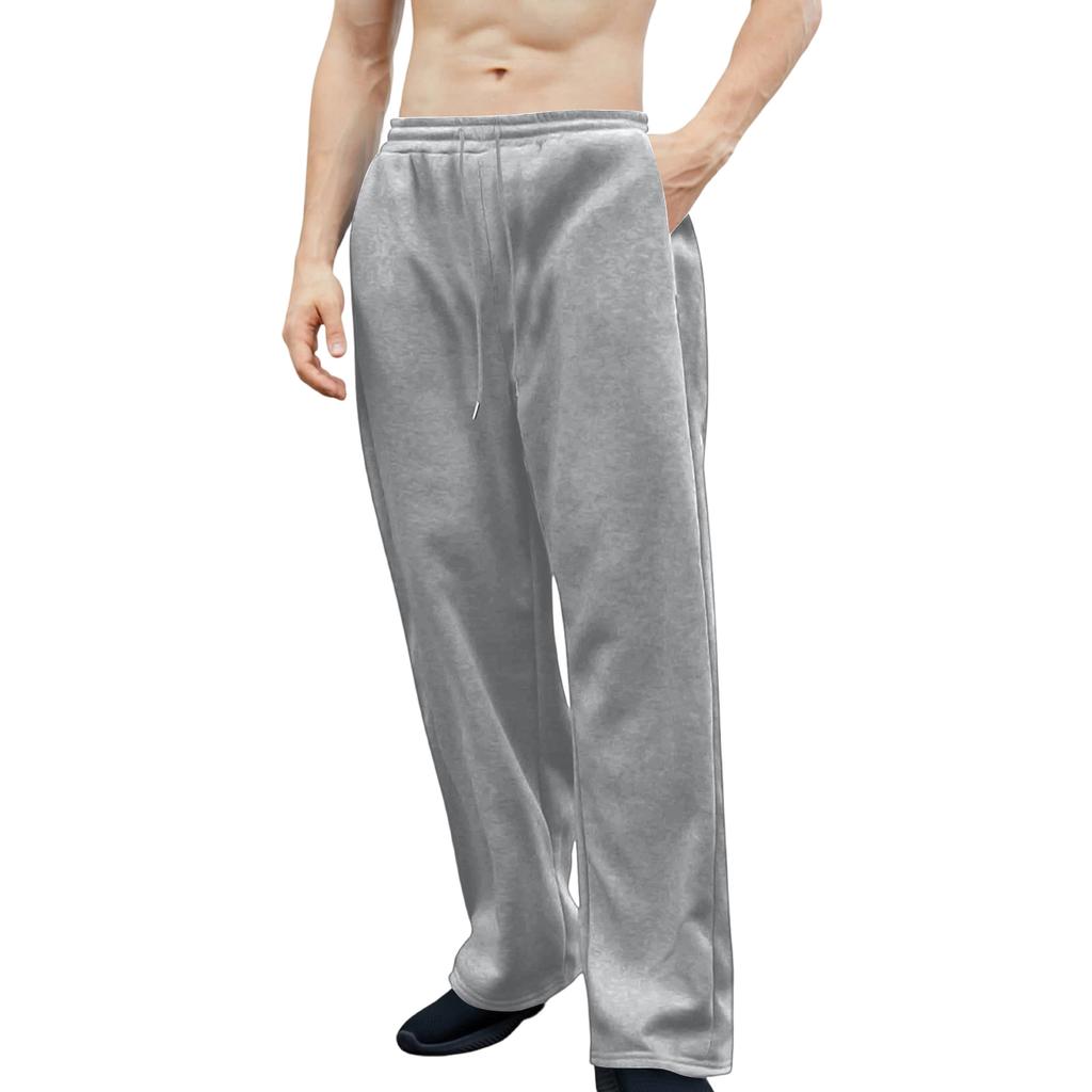 Pánské tepláky s elastickým pasem, rovný a široký střih, volný střih, s kapsami v pase.