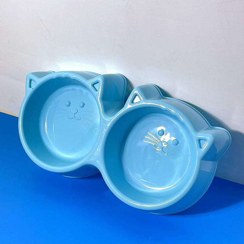 

Миска для кошек двойного назначения с защитой от проливания: Дизайн в виде круглой кошачьей мордочки, защита шейного отдела позвоночника, легко моющаяся двойная миска для еды и воды.