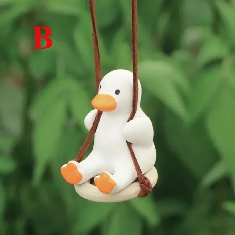 

The cute animated car interior gypsum swing duck car rearview mirror pendant is a decorative accessory for Kawai cars