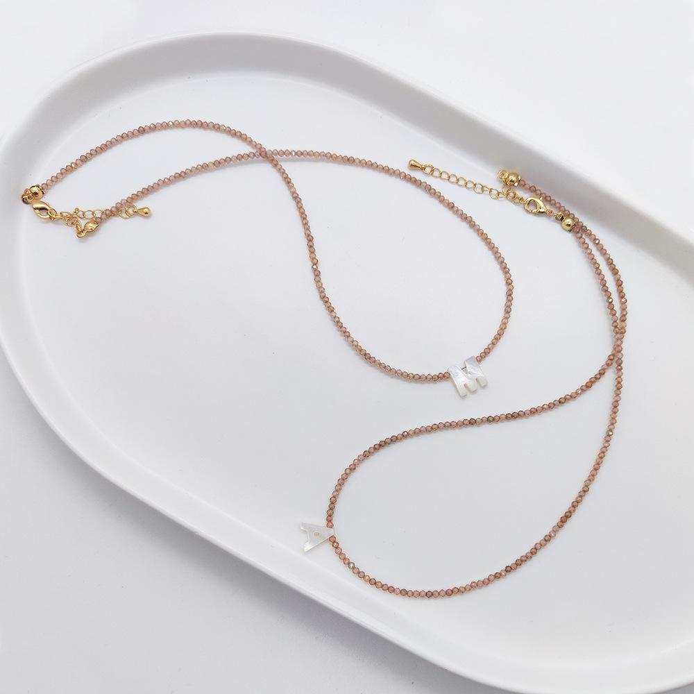 Elegant 2m Zircon Beaded Clavicle Chain: 26-Letter Deep Sea Shell Necklace for Women.