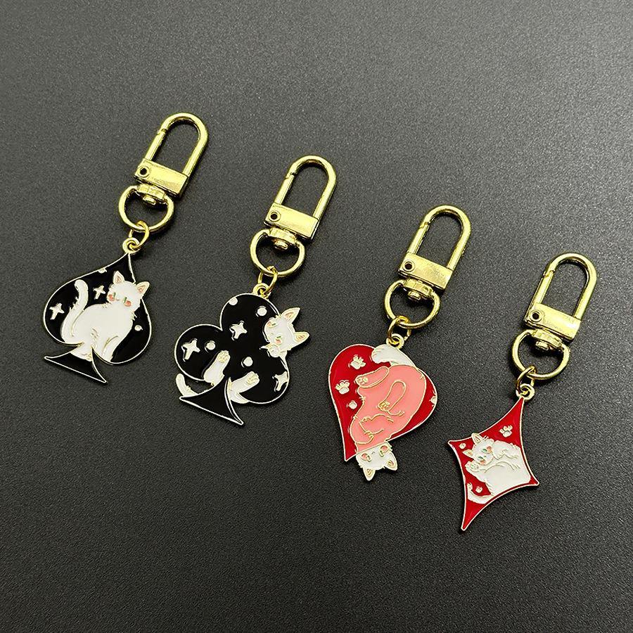 

Cartoon Cat Playing Card Keychain with Heart and Geometric Pendant