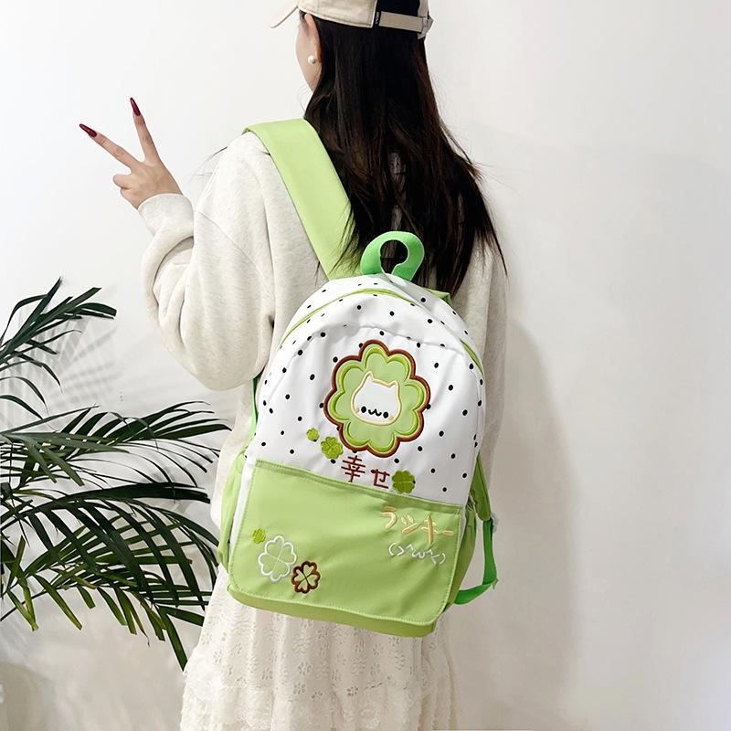 Schoolbag trendy high-value polka dot four-leaf clover cartoon backpack for junior and high school students cute kitten large-capacity schoolbag