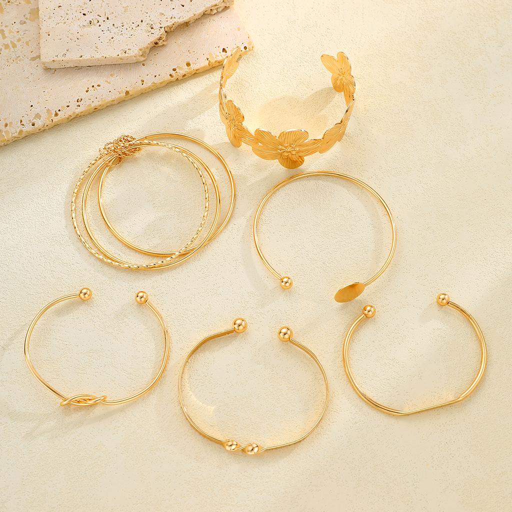 Elegante Vintage Hohllinien-Streifenblumen-Drehmetall-Armreif-Armband-Sets für Damen Tägliches Tragen Party Hochzeit Urlaub Schmuck