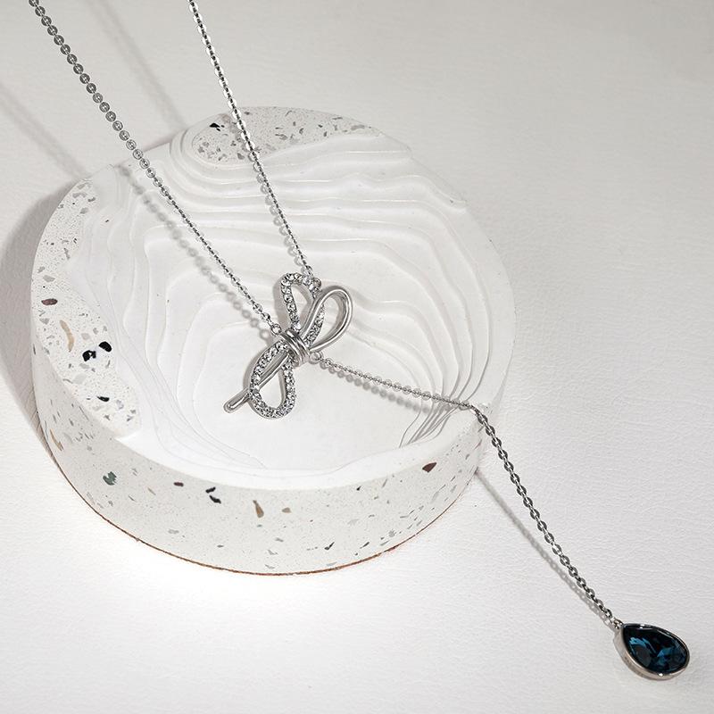 

Женское стильное ожерелье-бантик из премиальной титановой стали с шикарными кисточками Platinum