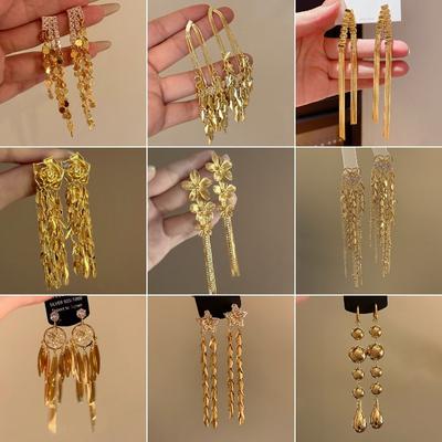 Boucles d'oreilles longues à pampilles de fleurs en métal Boucles d'oreilles atmosphériques françaises exagérées Niche Individuel Vent froid Boucles d'oreilles Femmes