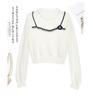 Elegant Women's Knit Top with White Lace Collar and Floral Brooch