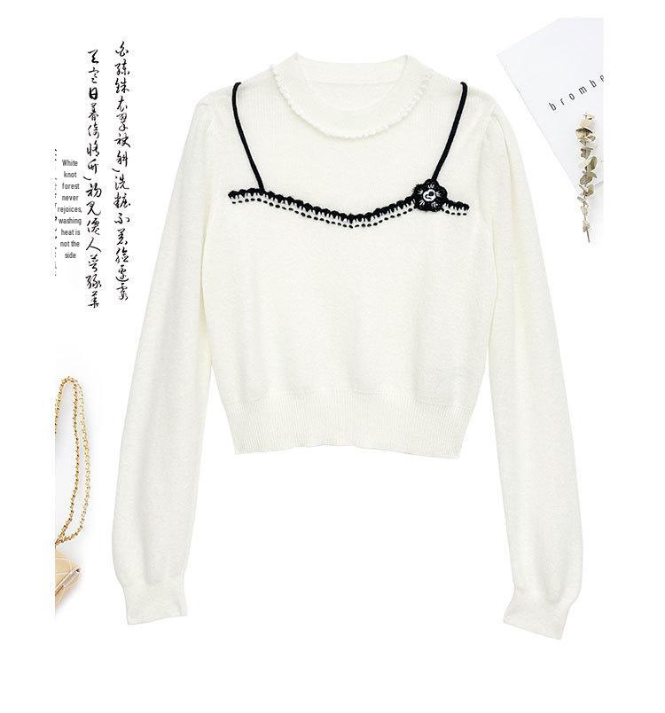 Elegant Women's Knit Top with White Lace Collar and Floral Brooch