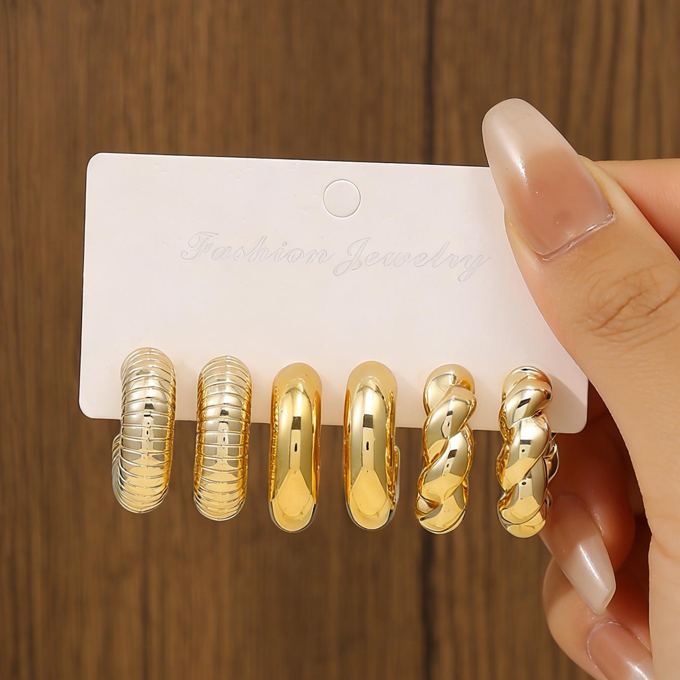 

On the new European and American dopamine exaggerated resin C-type water drop twist earrings trendy personalized earrings