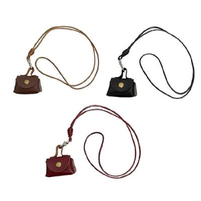 Elegante e robusto portafoglio da collo in pelle per riporre auricolari e monete. Design pratico per l'uso quotidiano.