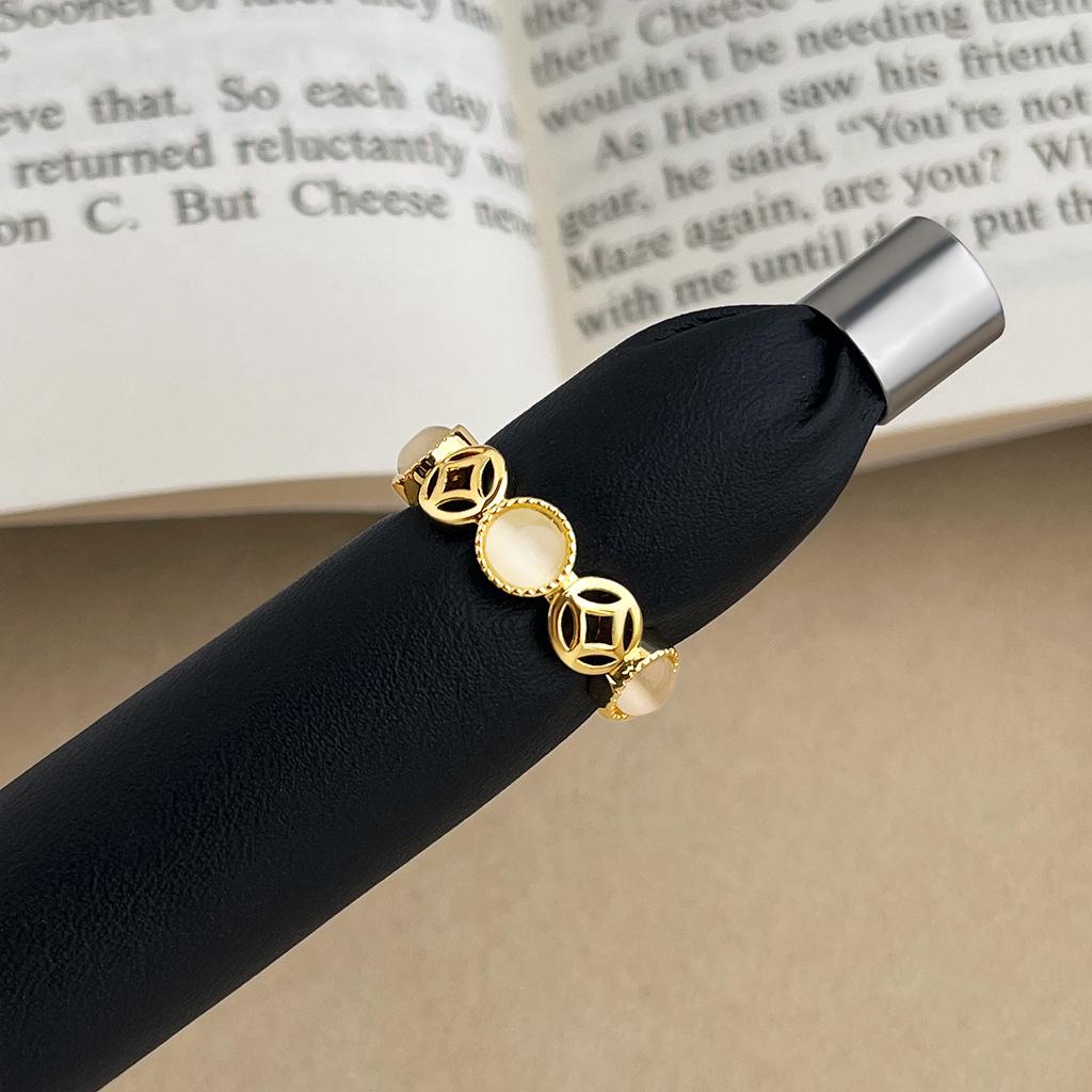Women's Vintage Retro Drip Glaze Copper Coin Open Ring: High-End Light Luxury Hollow Design for Personality and Style.