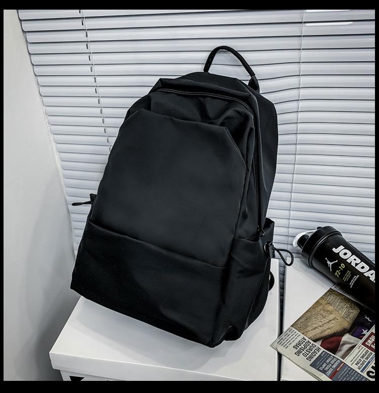 

Simple and fashionable casual backpack, Korean version of junior high school student schoolbag large capacity solid color shoulder can be printed logo Single Pack чёрный