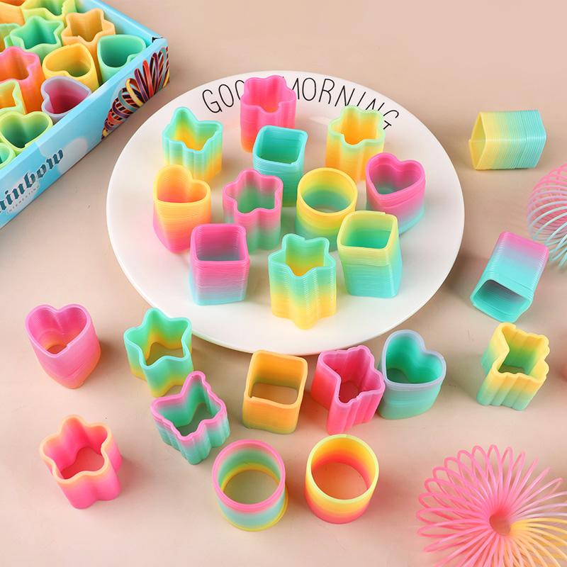 12/24 Stück Regenbogen Magische Feder Hüpfspielzeug Kindergeburtstag Mitgebsel Goodie Piñata Füller Fidget Spielzeug Kreative Weihnachtsgeschenke