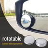 Small round mirror with 360 degree rotation for blind spot viewing, featuring convex glass for wide angle rear view assistance.