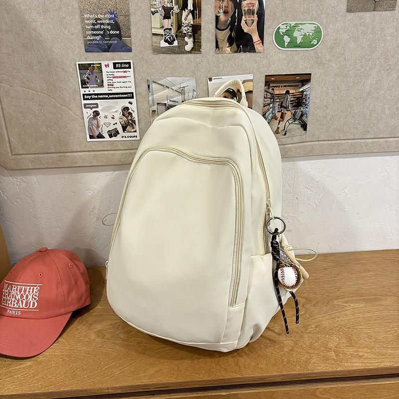 Casual solid color large-capacity schoolbag 2025 new versatile junior high school backpack college student travel backpack tide