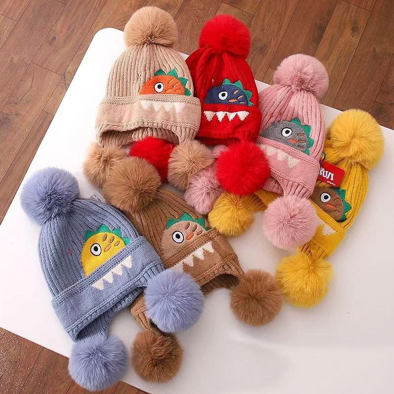 A children's dinosaur wool hat winter new cartoon jacquard knitted hat medium and older boys and girls ear hats
