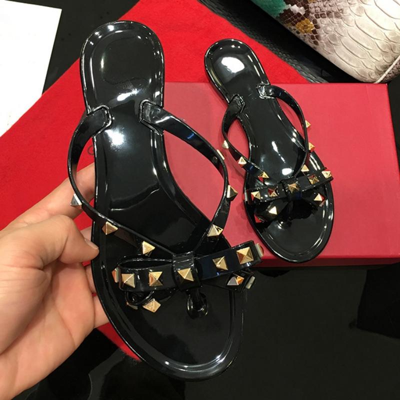 

Летние тапочки Женские модные шлепанцы Роскошный дизайнерский женский пляж Заклепка Большой бант Плоские сандалии Девушки Желейная обувь 36 чёрный