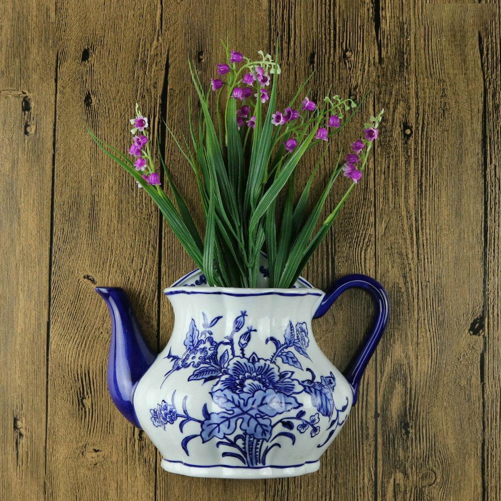 Hand-Painted Blue and White Ceramic Wall Vase with Floral and Bird Design