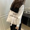 Summer large-capacity high-end sense commuting bucket bag women's 2025 new white leather bow messenger bag