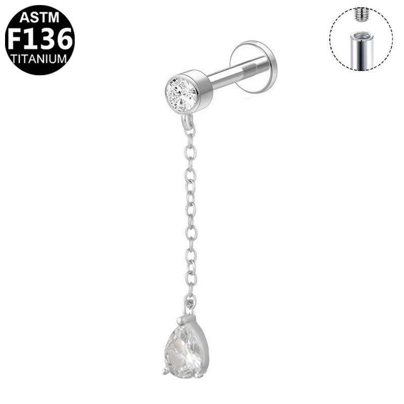G23 Titanium Cartilage Stud with Zircon Chain and Lightning-Inlaid Titanium Lip Stud.