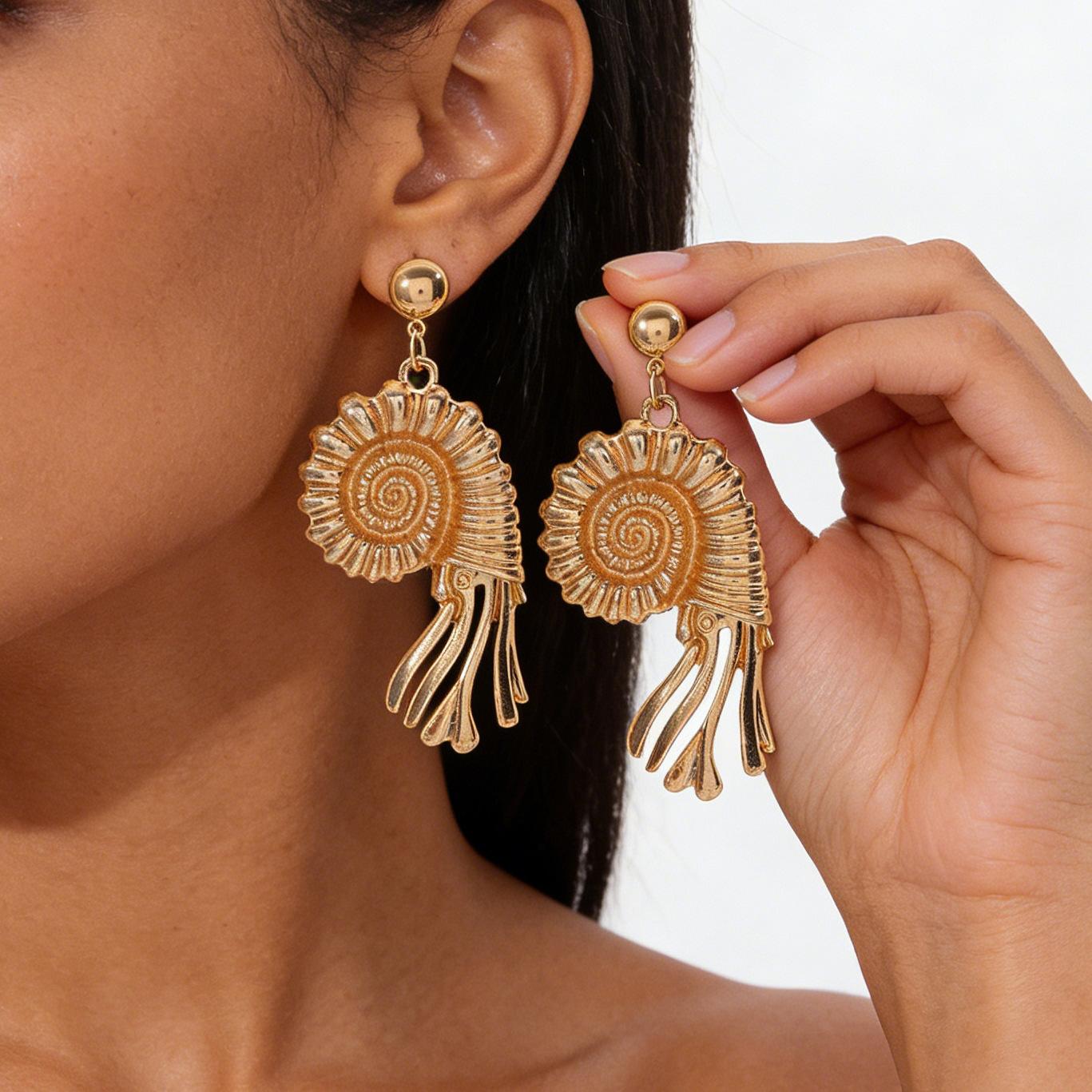 Spring and summer Hawaiian vacation style conch pendant earrings with natural ocean elements