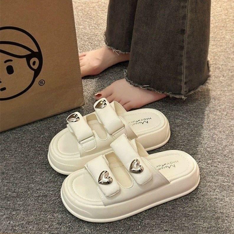 Internet celebrity super fire slippers women summer wear 2024 new stepping on shit feeling cross thick bottom heightening beach one word cool slippers