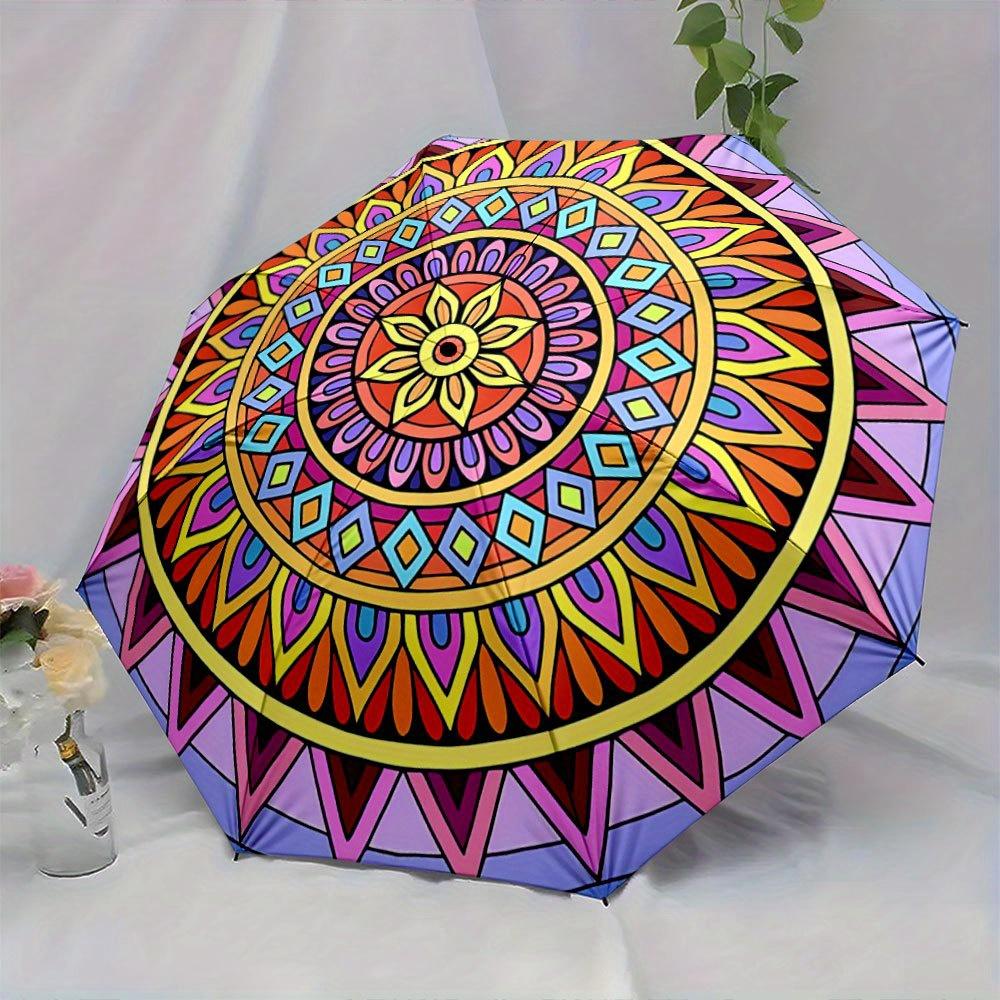 Folding Umbrella The umbrella features vibrant geometric mandala patterns with a central sunflower motif surrounded by layers